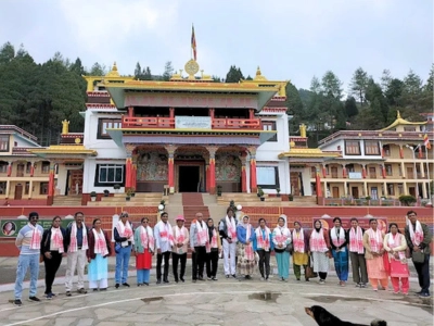 Group of guests with Supriya Travels in front of a monastery