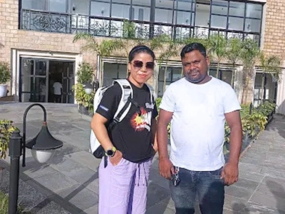 Two guests outside a building on a Supriya Travels trip
